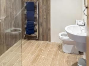 a bathroom with a shower and a toilet and a sink at Stewards Bothy - Uk48303 in Berwick-Upon-Tweed