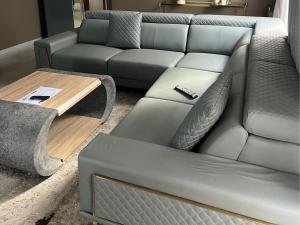 a living room with a couch and a coffee table at Vista Royale Luxury Villas in Mbabane