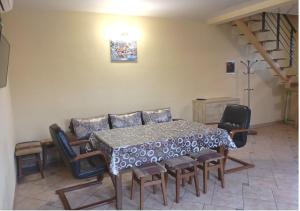 a dining room with a table and some chairs at Будинок у моря in Odesa +5 photos