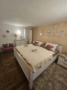 a bedroom with a large bed in a room at Villa Darche in Vrbnik