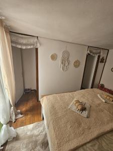 a bedroom with a bed with a towel on it at Villa Darche in Vrbnik