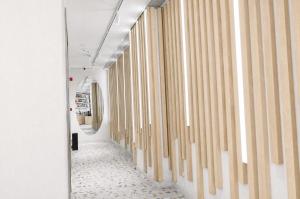 a hallway with wooden curtains and a mirror at Bird Nest Suites in Istanbul