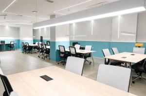 an empty classroom with tables and chairs at Bird Nest Suites in Istanbul