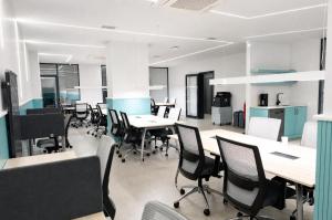 an empty office with tables and chairs in it at Bird Nest Suites in Istanbul +51 photos