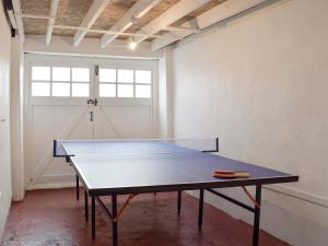 a ping pong table in a room with a window at Sea Breeze in The Mumbles