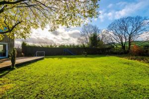 a large grassy yard with a playground at Ascot House in Buxton +52 photos