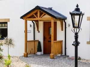 a gazebo on the side of a house at 15 Chivits - Ukc8971 in Warkworth
