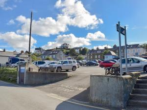 a parking lot with cars parked on a street at Seadrift in New Quay