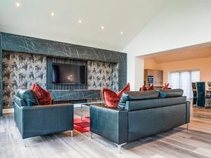 a living room with two couches and a tv at 13 Shearling - Ukc8974 in Warkworth
