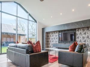 a living room with two couches and a tv at 13 Shearling - Ukc8974 in Warkworth +9 photos