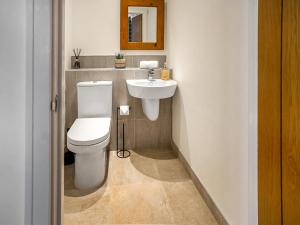 a bathroom with a toilet and a sink at 12 Galloway - Ukc8975 in Warkworth