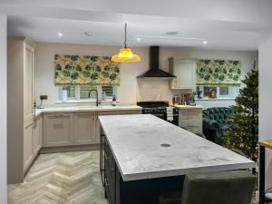 a kitchen with a christmas tree in the middle at Cannock Chase in Rugeley