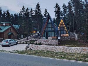 a house with a car parked in front of it at Villa Moonlight,Žabljak in Žabljak