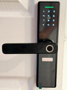 a doorhandle to a door with a lock on it at Brit Rooms Manchester in Manchester