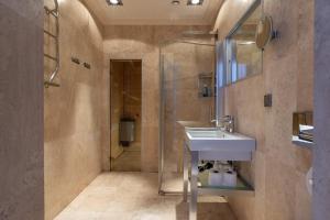 a bathroom with a sink and a shower at Central Stylish Retreat with Sauna in Åre