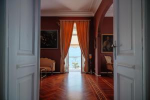 an open door to a living room with a window at Ca Meison in Cannobio