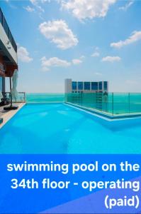a swimming pool on the floor of a building at Haeundae Elbon the Stay in Busan
