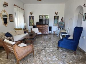 a living room with a couch and chairs at Villa Nostra - Kruče in Ulcinj