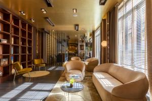 a living room with couches and chairs in a building at Palazzo Navona Hotel in Rome