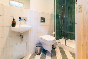 a bathroom with a toilet and a sink and a shower at Base Camp Hathersage, YHA Partner in Hathersage +15 photos