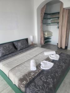 a bedroom with a bed with towels on it at Seaview apt. 3 complex Karia in Kavarna +30 photos