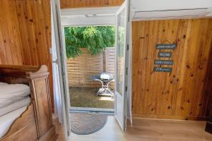 a room with a door open to a bedroom at Gite de Puisaye in Breteau +26 photos