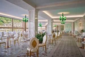 a rendering of a banquet hall with tables and chairs at Mythos Palace Resort - Adults Only in Boukari