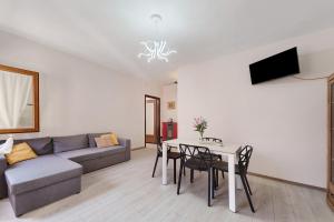 a living room with a couch and a table at Casa Margherita in Forno