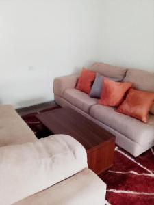 a living room with a couch and a coffee table at Modern Family Home in Ikoyi in Lagos