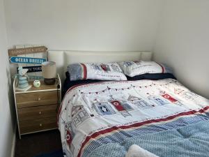 a bedroom with a bed with two pillows on it at The Lookout in Leysdown-on-Sea +9 photos
