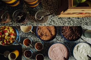 a collage of photos with bowls of food on a counter at URBAN LOFT Cologne in Cologne