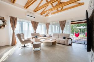 a living room with a couch and a table at Villa Verdura in Budva