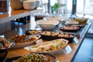 a buffet of different types of food on a table at Glamping -420 in Kalia