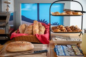 a display of bread and pastries on a table at Glamping -420 in Kalia
