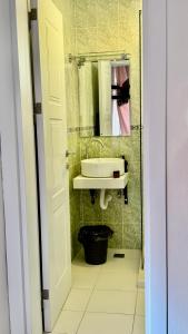 a bathroom with a sink and a mirror at Villa Guci in Ulcinj +37 photos