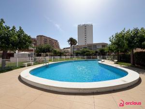 a large swimming pool in the middle of a city at Bloom House in Oropesa del Mar