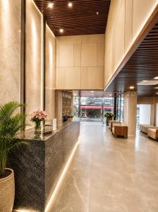 a lobby of a building with a reception desk at Autumn Sea Boutique Hotel in Nha Trang