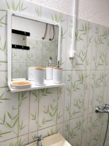 a bathroom with a sink and a mirror at Alojamiento EYO en Chuy con Baño Privado y Aire Acondicionado in Chuy +13 photos