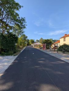 an empty street with trees on the side of the road at Studio cozy 2pp wifi in La Sicaudais +6 photos