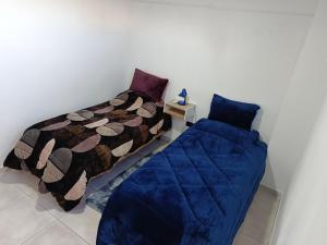 a bedroom with a bed and a couch at Concordia, Entre Rios in Concordia