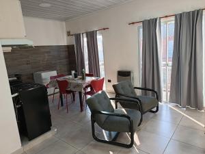 a kitchen and dining room with a table and chairs at Concordia, Entre Rios in Concordia
