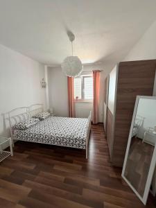 a bedroom with a bed and a mirror in it at Holiday home " MIA" in Gradina