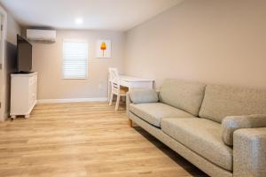 a living room with a couch and a table at Blue Lobster Inn Cape Cod in Yarmouth