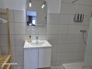 a white bathroom with a sink and a shower at Les Lézards 2 au Soleil Draguignan in Draguignan +26 photos