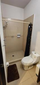 a bathroom with a shower with a toilet and a sink at Casa Misiones 1 in El Espino
