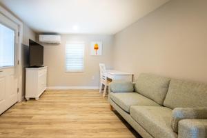 a living room with a couch and a table at Blue Lobster Inn Cape Cod in Yarmouth