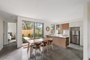 a kitchen and dining room with a table and chairs at The Cape Collective 5 in Margaret River Town