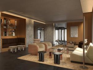 a living room with couches and chairs and tables at Hotel Le Morgane in Chamonix +14 photos