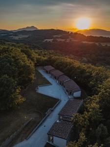 an overhead view of a row of buildings at sunset at Amandelia in Fardella