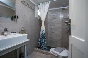a bathroom with a sink and a shower at Medieval Inn in Rhodes Town +90 photos